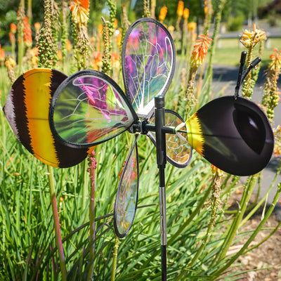 Pivoting Bumble Bee Bug Spinner with vibrant bumble bee design and iridescent wings displayed in an outdoor garden setting, spinning in the wind.
