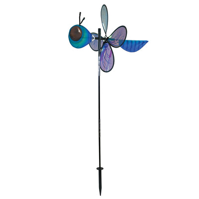 Pivoting Dragonfly Bug Spinner featuring iridescent Mylar wings and a fiberglass frame, elegantly displayed in a vibrant garden setting.