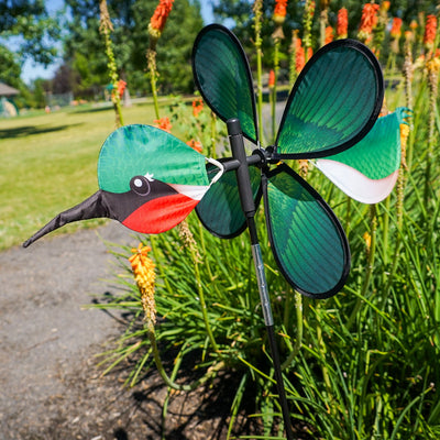 Pivoting Hummingbird Spinner featuring a colorful 15-inch petal wheel, showcasing hummingbirds, spins and pivots in the garden.
