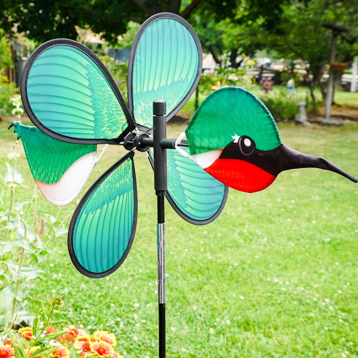 Pivoting Hummingbird Spinner featuring a colorful 15-inch petal wheel, showcasing hummingbirds, spins and pivots in the garden.