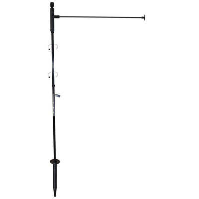 Pivoting Low-Profile Garden Flag Pole displayed in a garden with a vibrant 12x18-inch garden flag attached, showcasing its flexible design.