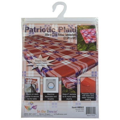 Plaid 6' Tablecloth spread over a picnic table in a sunny outdoor setting, secured with deep pockets, enhancing the cheerful atmosphere.
