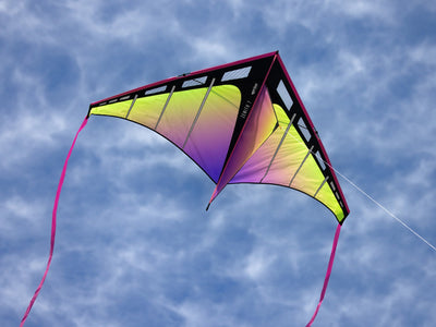 large delta kite with 7 foot wingspan flying in open sky with ribbon tails and strong pull for lifting accessories