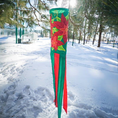 Poinsettia 40" Windsock displaying vibrant red flowers and colorful tails, fluttering in the wind, perfect for winter holiday outdoor decoration.