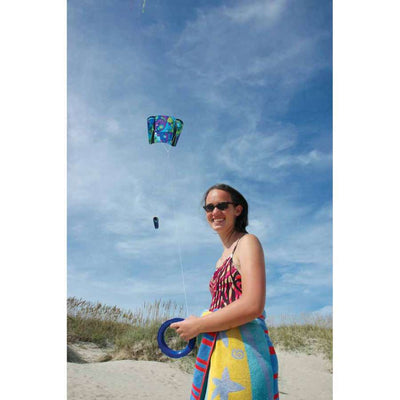 Power Sled 10 Kite - Cool Orbit flying in the sky, showcasing its vibrant design with a backdrop of blue clouds.