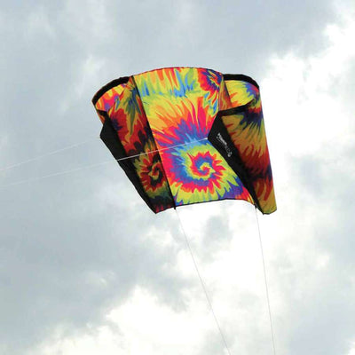 Colorful tie-dye Power Sled 10 Kite flying effortlessly, measuring 36x27 inches, designed for varied wind conditions, showcased against a blue sky.