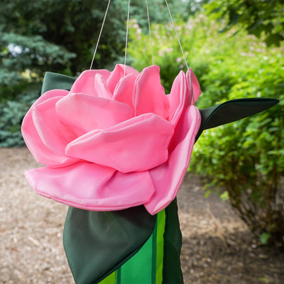 Pretty as a Rose Floral Windtail featuring 3D rose blossoms and color-coordinated tails hanging gracefully in an outdoor setting.