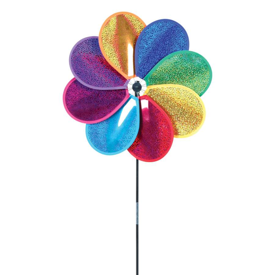 Prismatic Deluxe Daisy Spinner showcasing eight holographic petals spinning in the sunlight, creating a colorful display in an outdoor garden setting.