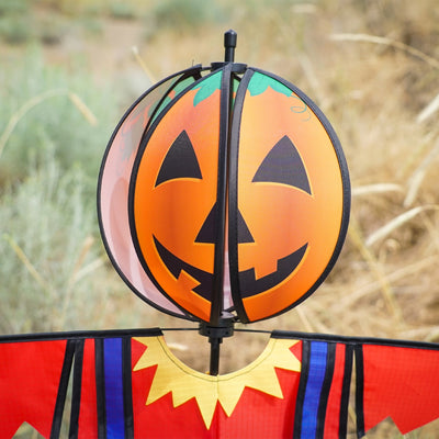 Pumpkin Scarecrow Ground Ball Spinner featuring vibrant pumpkin head and colorful attire, standing tall in a garden setting.