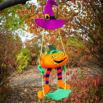 Pumpkin Swingerz 3D garden decoration with a smiling jack-o-lantern swinging beneath a witch's hat, showcasing its fun detailed design.