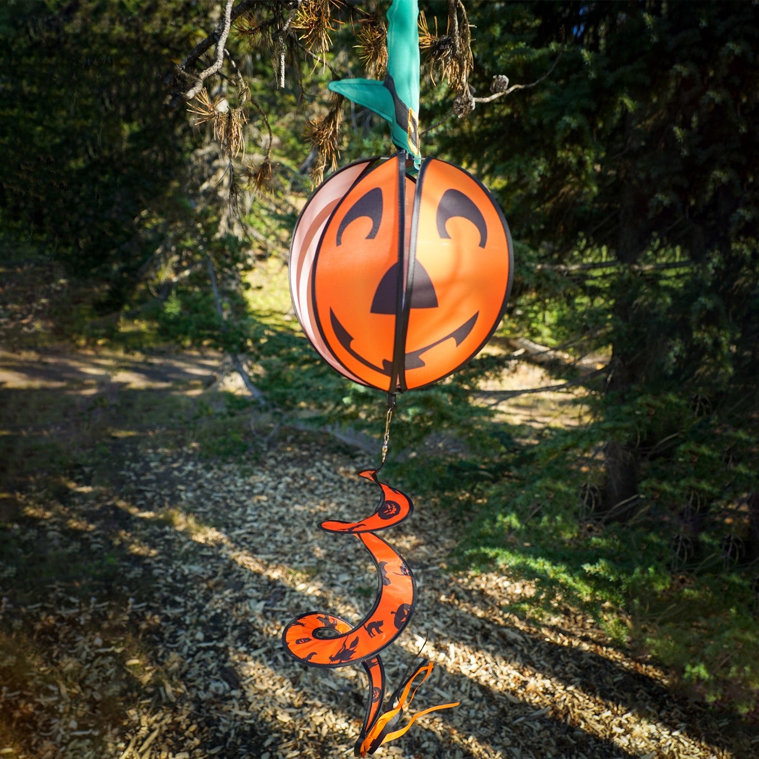 Pumpkin with Hat Hanging Ball Spinner featuring a friendly pumpkin face and colorful hat, spinning in a garden setting during autumn.