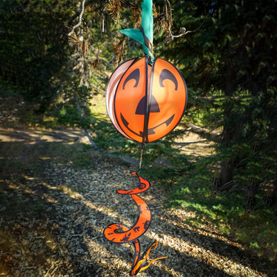 Pumpkin with Hat Hanging Ball Spinner featuring a friendly pumpkin face and colorful hat, spinning in a garden setting during autumn.