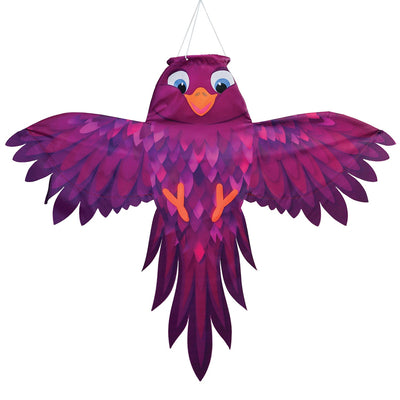 Colorful Purple Bird Windsock with spread wings fluttering in a gentle breeze, showcasing vibrant purple hues in an outdoor setting.