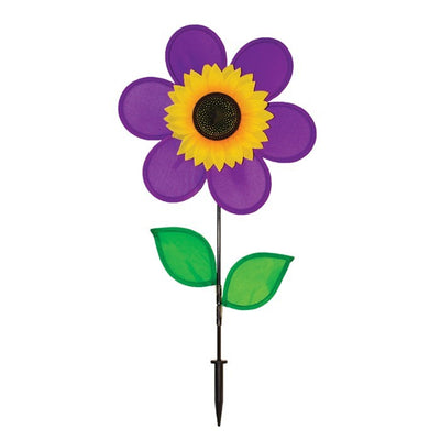 Vibrant 12-inch Purple Sunflower Spinner with purple petals and green leaves displayed in an outdoor garden setting, spinning gently in the breeze.