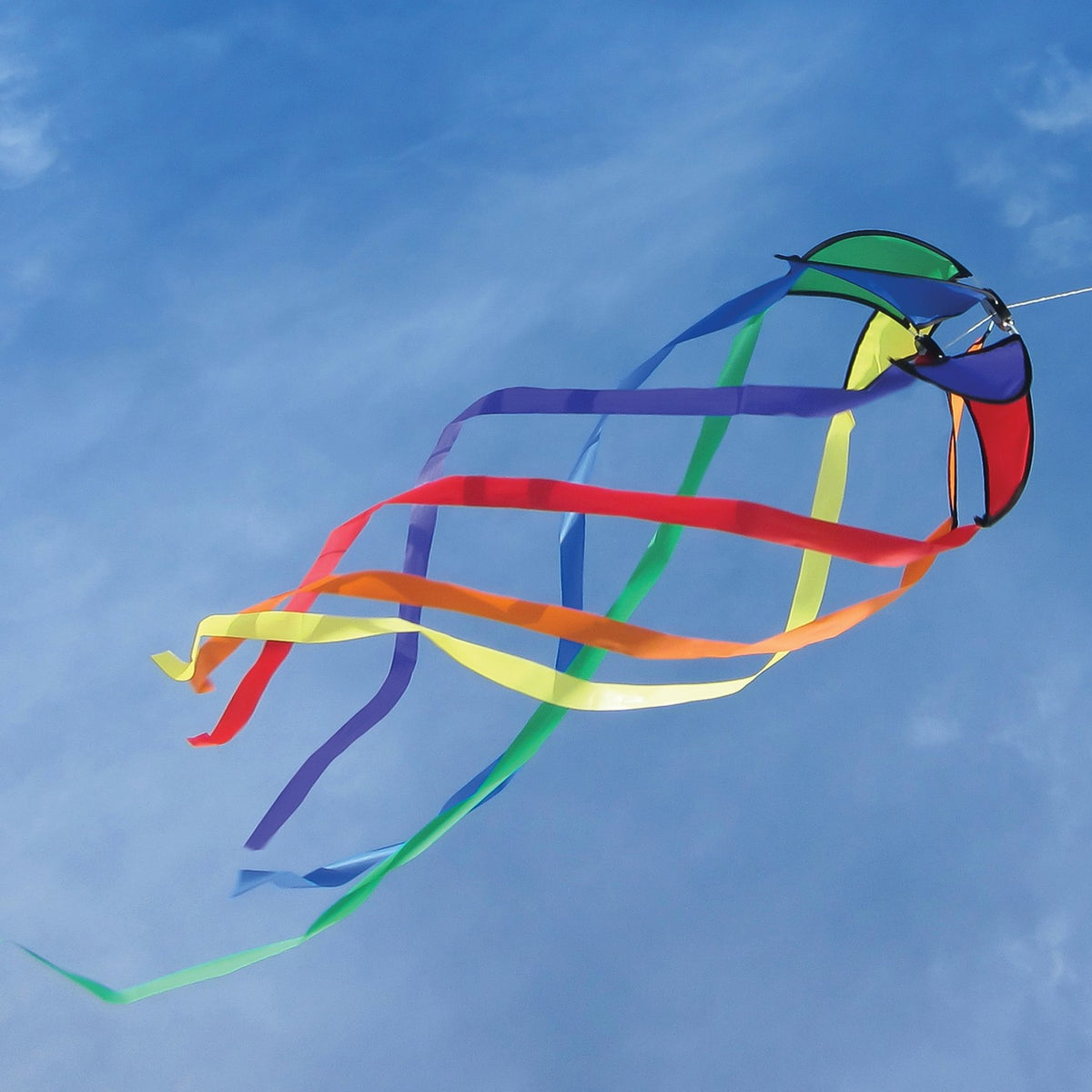 Rainbow 12-inch Orbiter Star with 40-inch streamer tails displayed outdoors, showcasing vibrant colors rotating in the breeze.