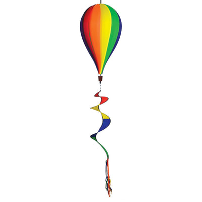 Vibrant Rainbow 12-Panel Hot Air Balloon spinner in a garden setting, showcasing colorful panels and twister tail spinning gracefully.