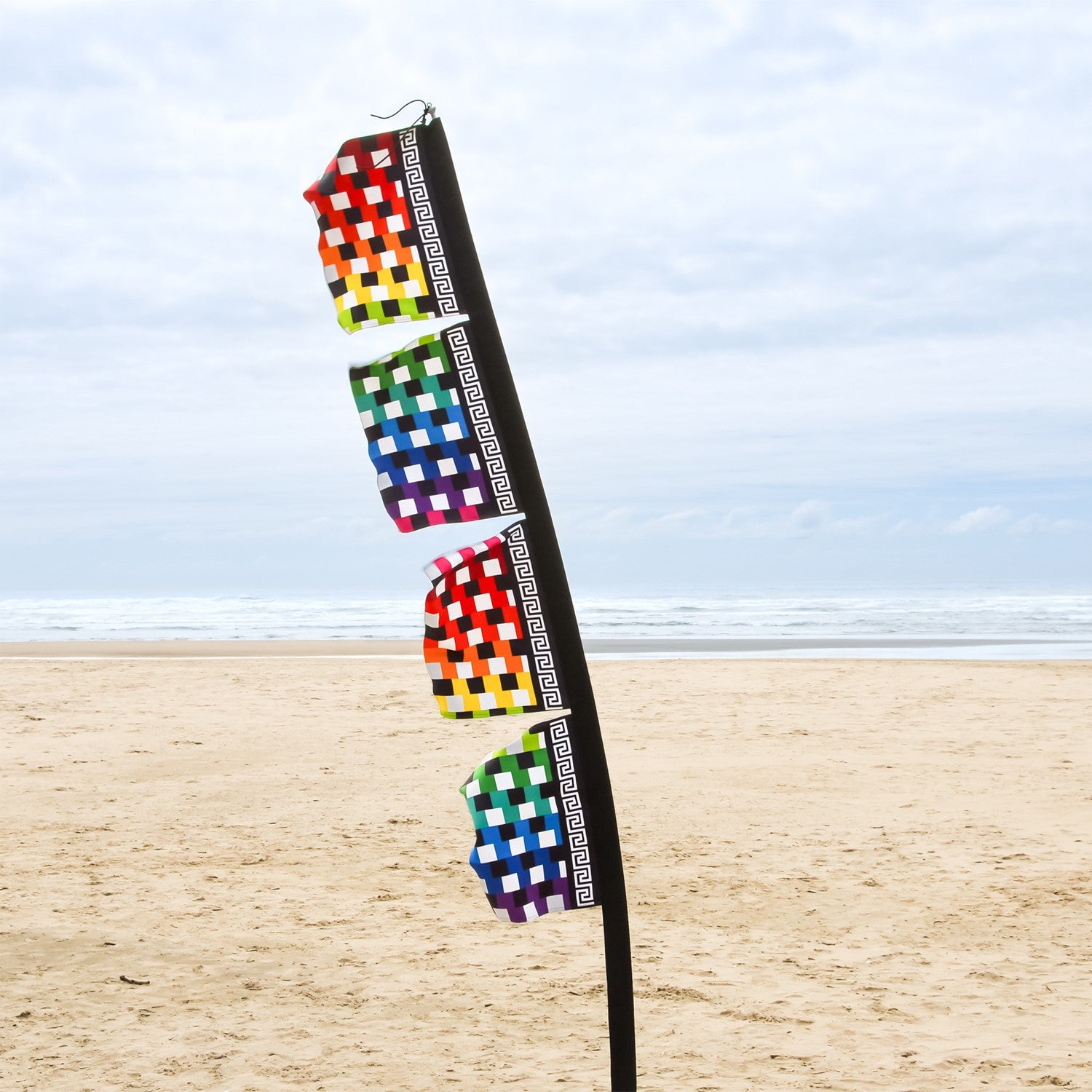 Rainbow 17'' x 82'' 4-Section Feather Banner, featuring colorful designs on outdoor display with a heavy-duty pole sleeve.