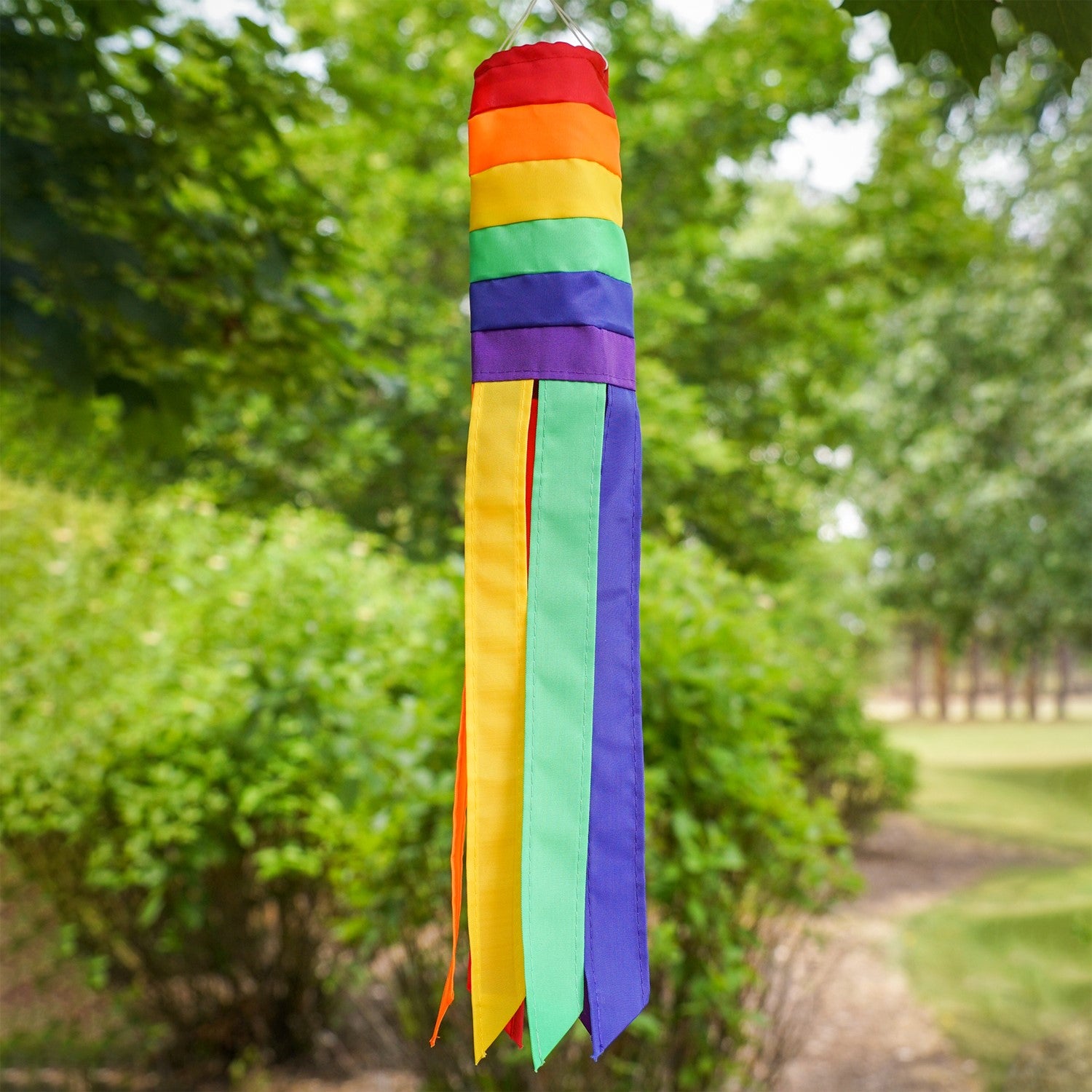 Rainbow 18-inch windsock features bright colors and applique graphics, fluttering tails create a joyful outdoor decoration perfect for any garden setting.