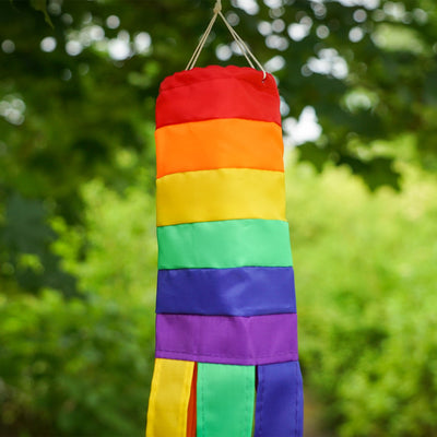 Rainbow 18-inch windsock features bright colors and applique graphics, fluttering tails create a joyful outdoor decoration perfect for any garden setting.