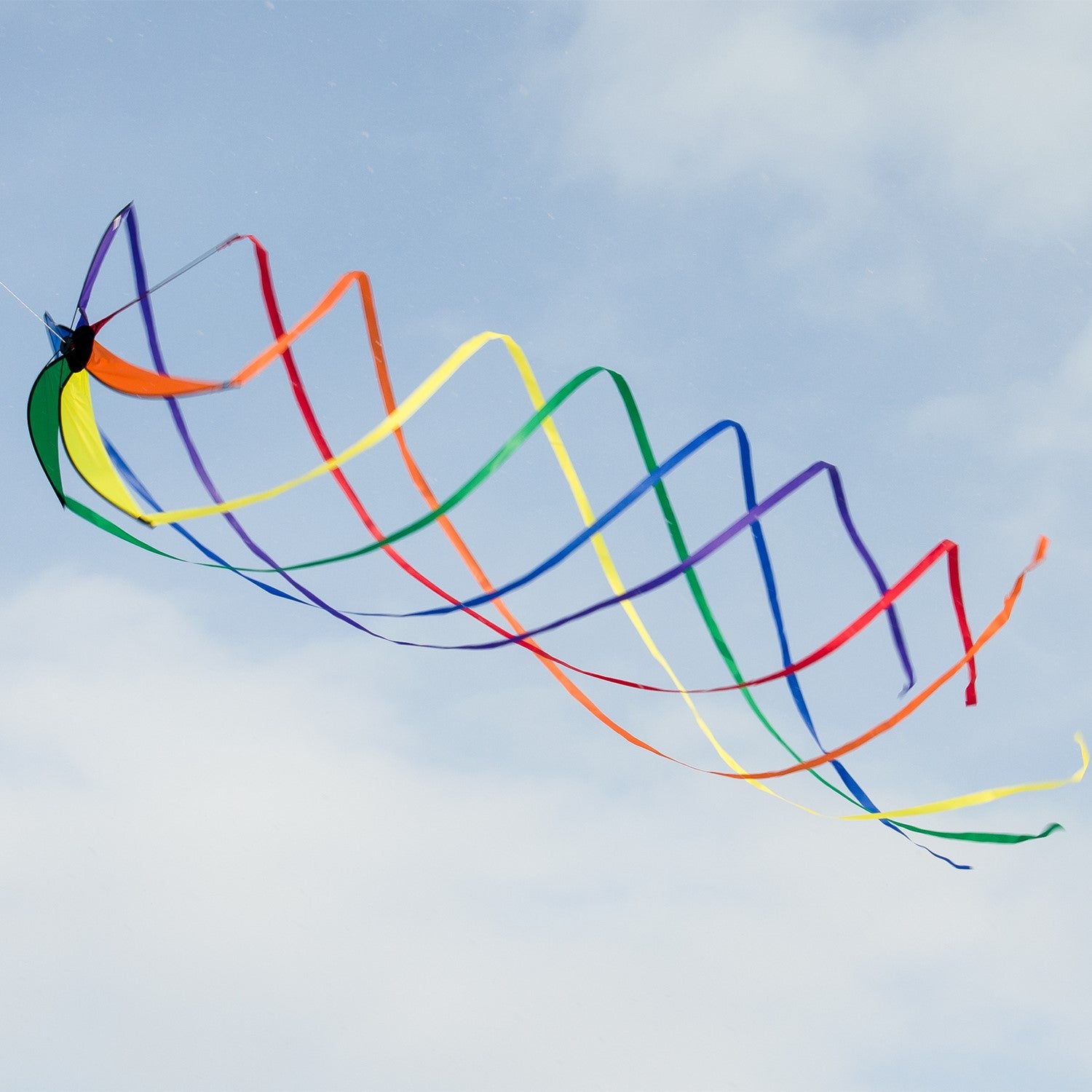 Rainbow 30" Orbiter Star with striking rainbow colors and flowing streamer tails, bringing a joyful touch to gardens and outdoor spaces.