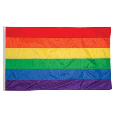 Rainbow 3x5 Grommet Flag featuring bright colors and brass grommets displayed on an outdoor flag pole against a clear blue sky.