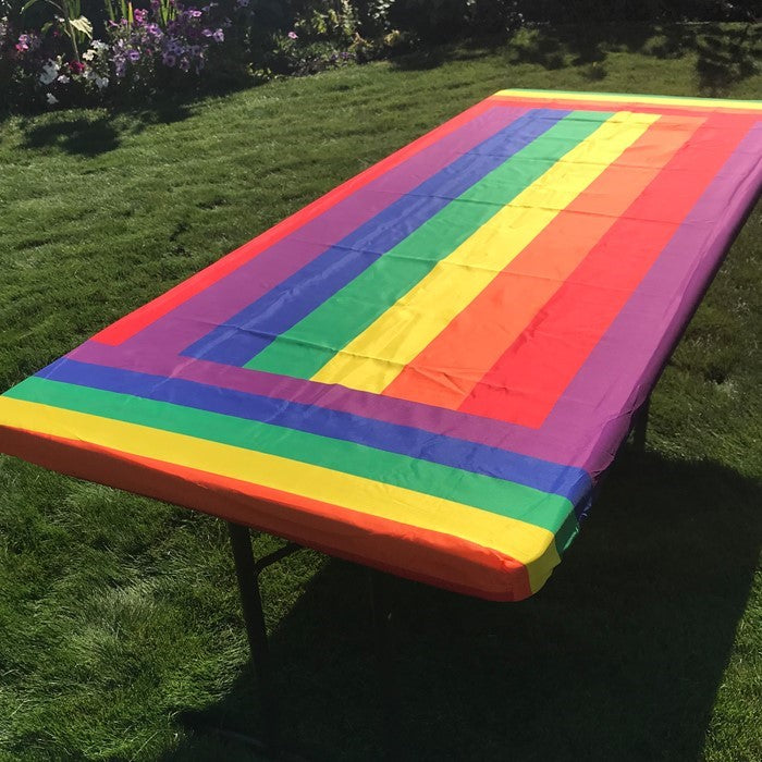 Rainbow 6' Tablecloth with vibrant colors and durable outdoor fabric, perfect for picnics and events-featuring elastic pockets for secure fit.