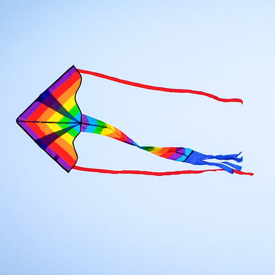 Rainbow Arrow Fly-Hi Kite soaring high in the sky, displaying colorful streamer tails, perfect for outdoor family fun.
