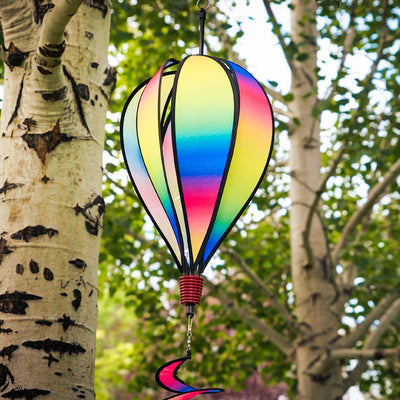 Rainbow Blended Hot Air Balloon with blended colorful panels, twister tail, and clear plastic accents displayed in an outdoor setting.