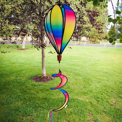 Rainbow Blended Hot Air Balloon with blended colorful panels, twister tail, and clear plastic accents displayed in an outdoor setting.