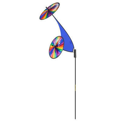 Rainbow Blue Space Flower Ground Spinner features dual wheels on a fiberglass frame, spinning in a colorful display in a garden setting.