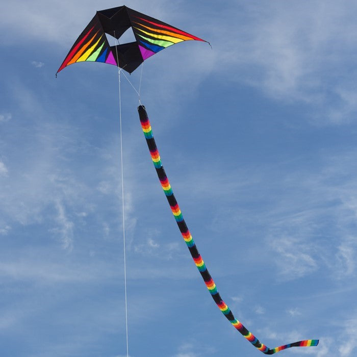Rainbow Burst 6' Conyne Delta Kite featuring vibrant colors displayed in an outdoor setting with blue skies and fluffy clouds, ideal for family fun.
