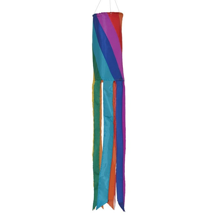 Rainbow Diagonal 60" windsock in bright colors with embroidered accents and eight fluttering tails hanging gracefully outdoors.
