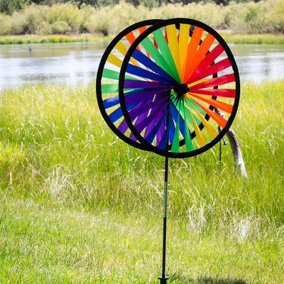 Rainbow Duo Wheel Spinner featuring two colorful spinning wheels on a fiberglass pole, creating a vibrant outdoor decoration.