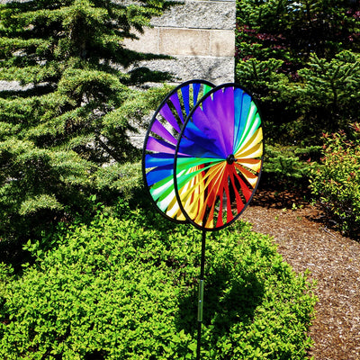 Rainbow Duo Wheel Spinner featuring two colorful spinning wheels on a fiberglass pole, creating a vibrant outdoor decoration.