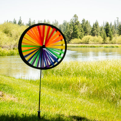 Rainbow Duo Wheel Spinner featuring two colorful spinning wheels on a fiberglass pole, creating a vibrant outdoor decoration.