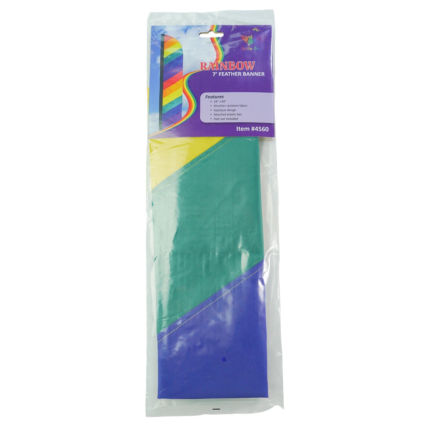 7-foot Rainbow Feather Banner with colorful applique stripes standing on an outdoor pole, illuminated by sunlight for a vibrant display.