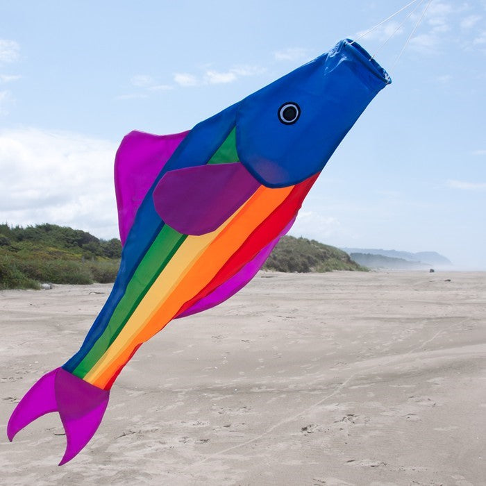 Rainbow Fishy 48-inch Fishsock in vibrant colors hanging gracefully in a garden setting, showcasing its playful design and durable construction.
