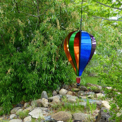 Rainbow Glitter 6-Panel Hot Air Balloon in an outdoor setting, showing colorful sparkling Mylar and ready to spin in the breeze.