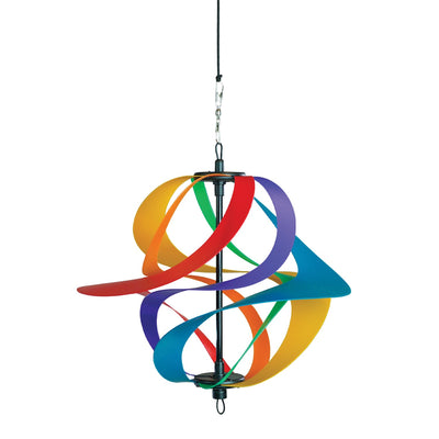Colorful Rainbow Poly Vortex Spinner with six interconnected spirals hanging in a garden, spinning gently in the breeze.