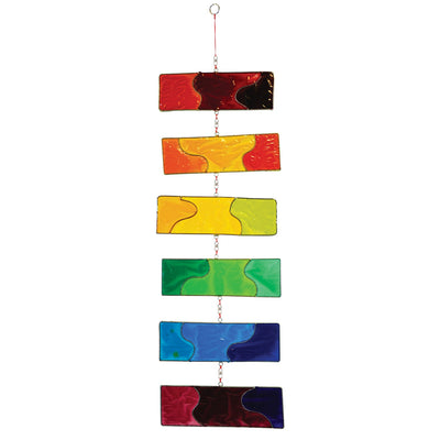 Rainbow Resin Mobile with six colorful translucent blocks hanging outdoors, catching sunlight and swaying gently in the breeze.