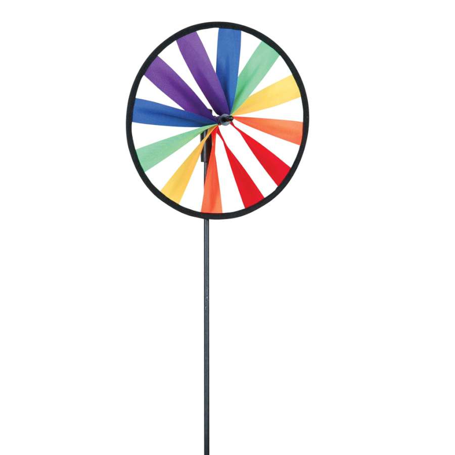 Rainbow Single Wheel Spinner with colorful fabric design gracefully spinning in a gently breezy garden setting.