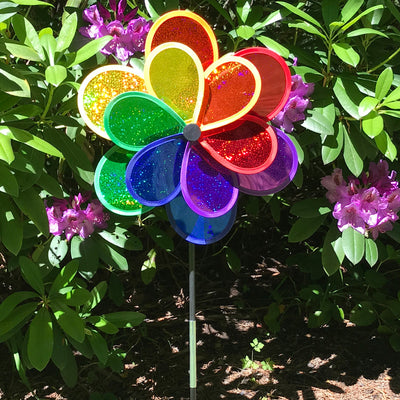 Rainbow Sparkle Double Flower garden spinner featuring double Mylar petals in a brilliant rainbow spectrum, easily rotates in the breeze to brighten gardens.