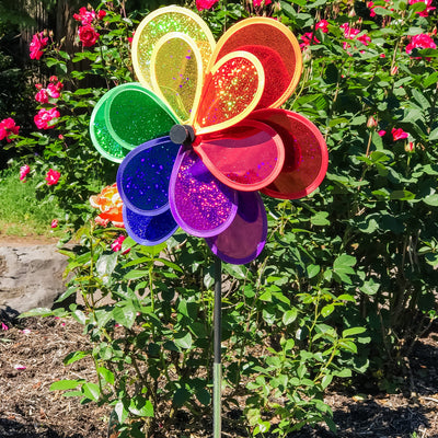 Rainbow Sparkle Double Flower garden spinner featuring double Mylar petals in a brilliant rainbow spectrum, easily rotates in the breeze to brighten gardens.