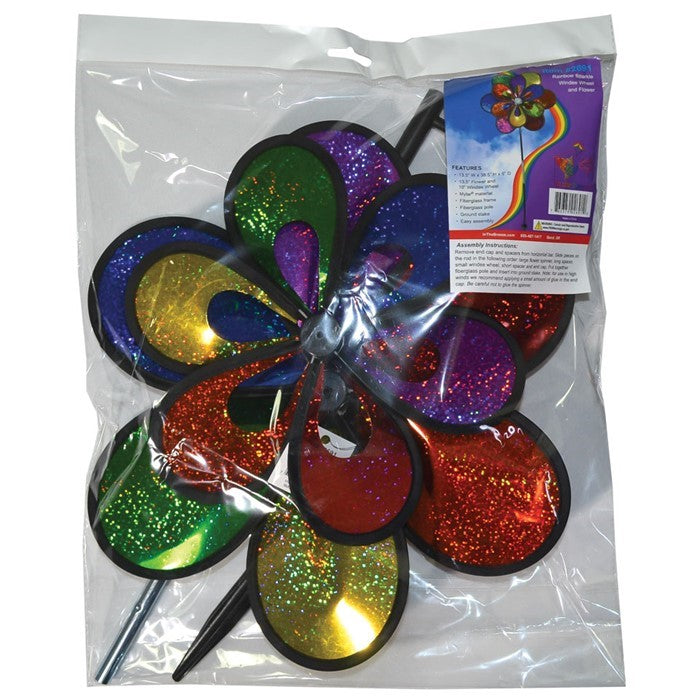 Rainbow Sparkle Windee Wheelz and Flower Spinner featuring double Mylar wheels adorned with colorful petals, spinning in a gentle breeze in a garden setting.