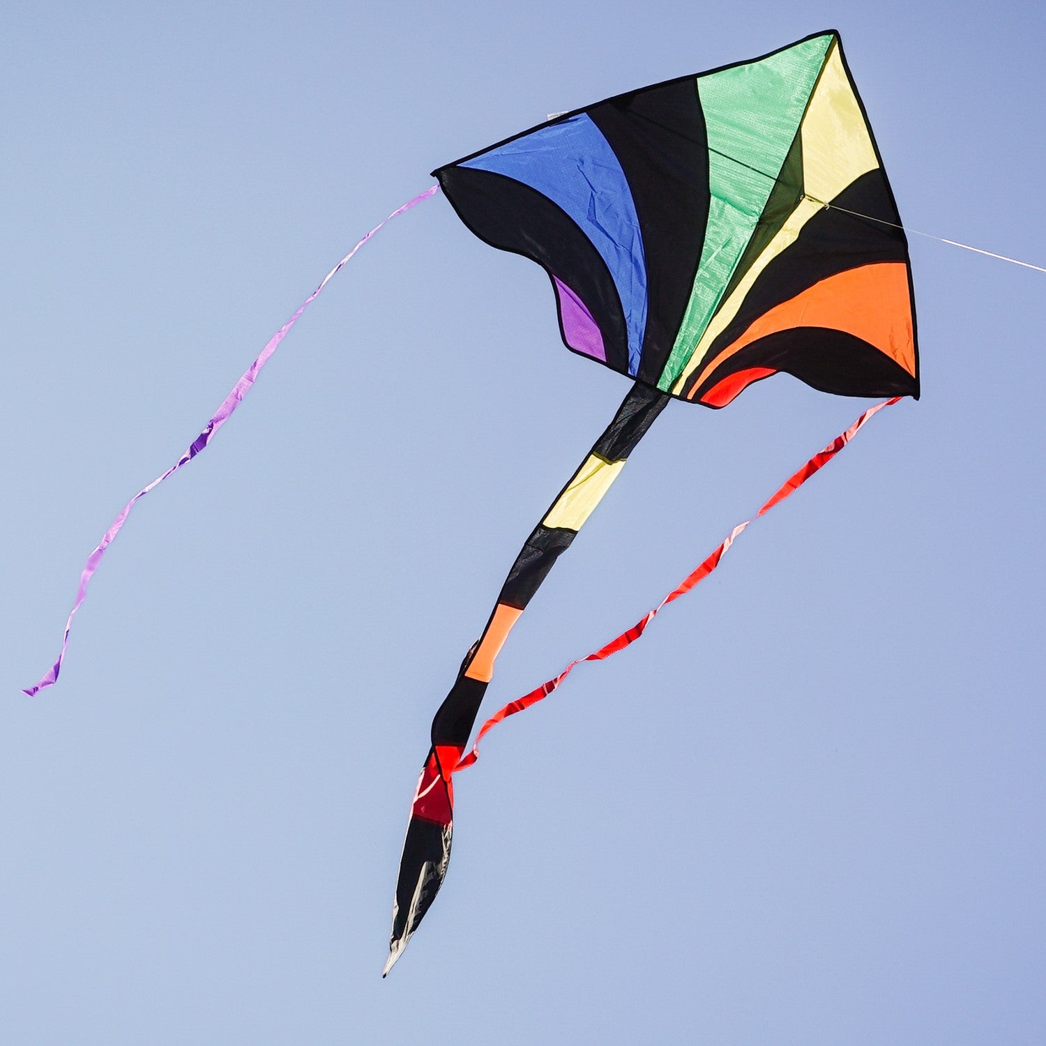 Capture the excitement of flying the Rainbow Sparkler Fly-Hi Kite, a vibrant and colorful kite designed for family fun and outdoor play, soaring against the sky.