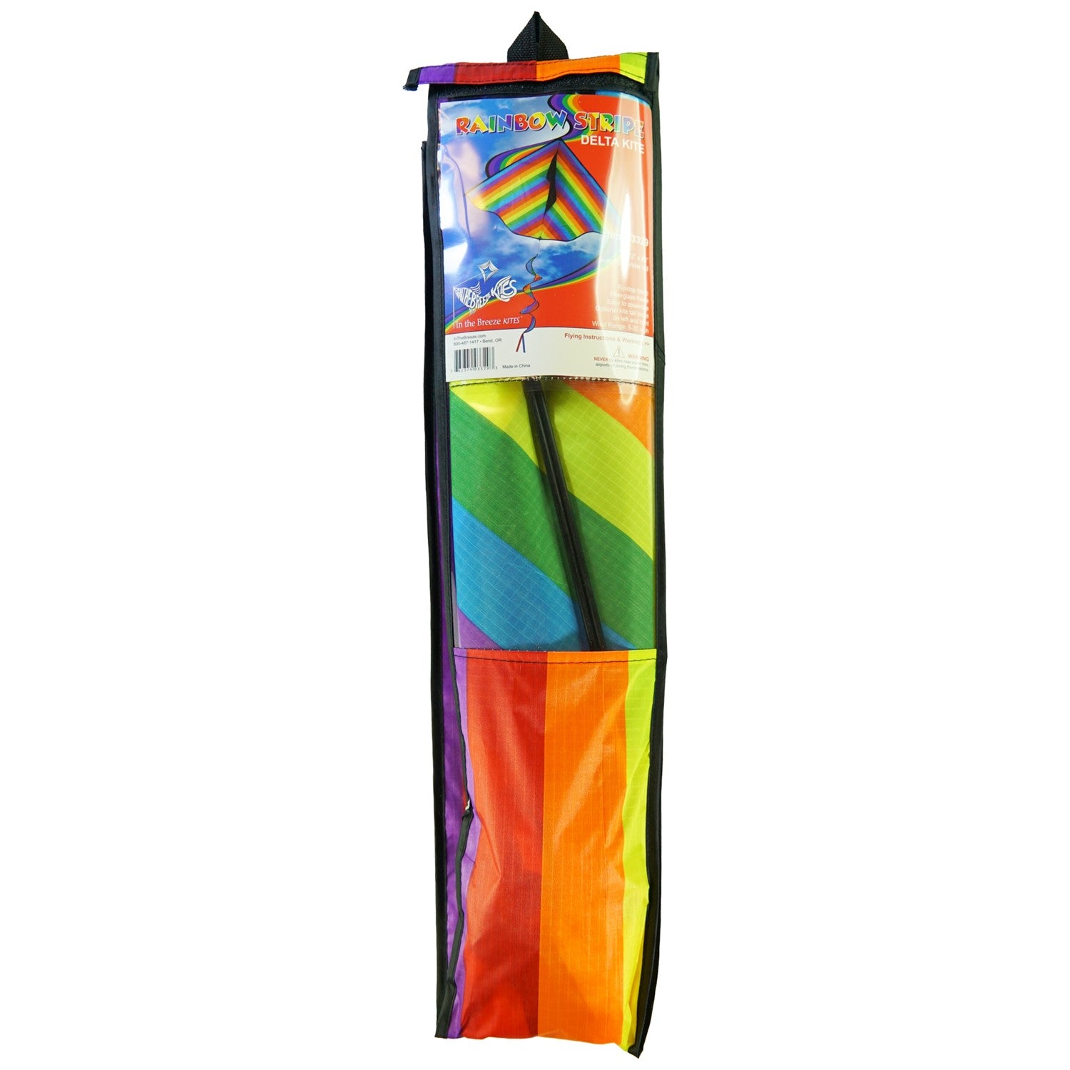Rainbow Stripe 72'' Delta kite with colorful spinning tail flying in a blue sky above a park setting, showcasing its vibrant design and construction.