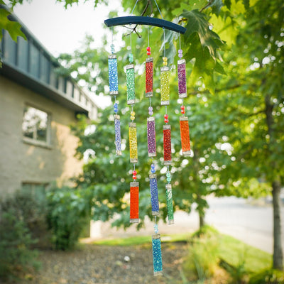 Rainbow Textured Tiered Glass Mobile Wind Chime featuring vibrant glass pieces and beads hanging in sunlight, creating a colorful display outdoors.