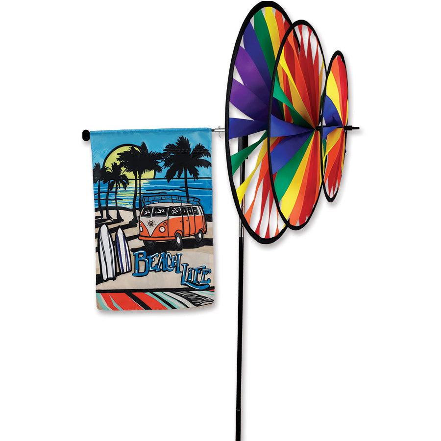 Rainbow Triple Spinner Garden Flag Pole with vibrant SunTex fabric displayed outdoors, showcasing dazzling spinning motion and sturdy construction.