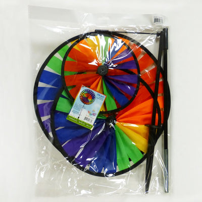Rainbow Triple Wheel Spinner made with colorful wheels and sturdy fiberglass frame, beautifully spinning outdoors for garden charm and fun.