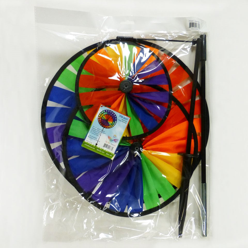 Rainbow Triple Wheel Spinner made with colorful wheels and sturdy fiberglass frame, beautifully spinning outdoors for garden charm and fun.